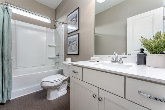 full bathroom featuring vanity, shower / bathtub combination with curtain, and toilet