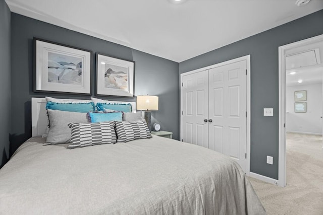 carpeted bedroom with a closet