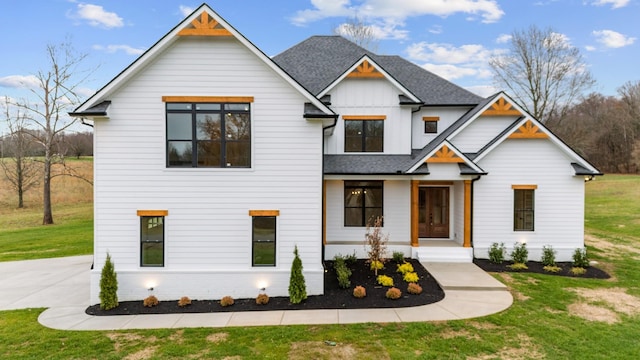 modern farmhouse with a front lawn