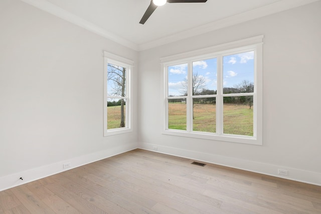 unfurnished room featuring crown molding, ceiling fan, and light wood-type flooring