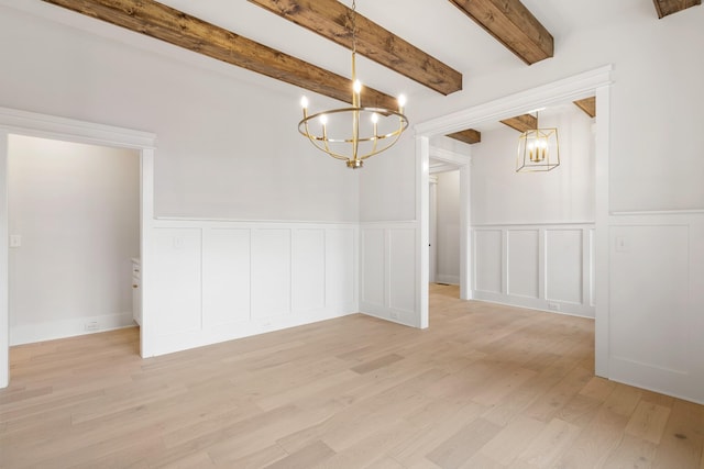 unfurnished dining area with beamed ceiling, light hardwood / wood-style flooring, and a notable chandelier