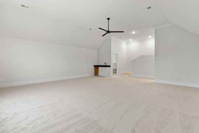 additional living space featuring ceiling fan, light colored carpet, and lofted ceiling