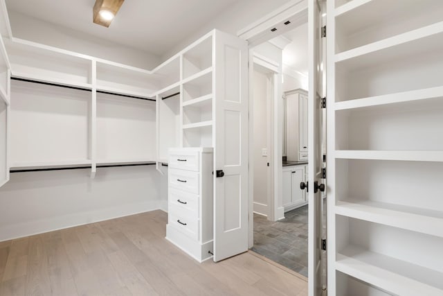 walk in closet featuring light wood-type flooring