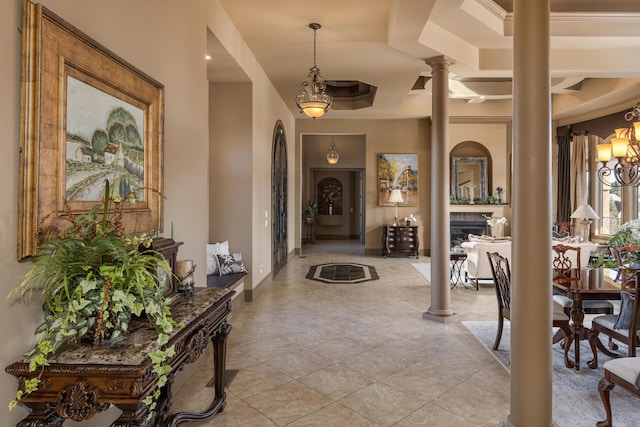 tiled foyer entrance featuring decorative columns