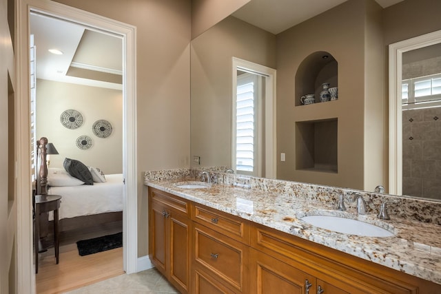 bathroom featuring a healthy amount of sunlight, vanity, and tile patterned floors