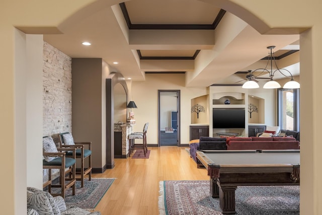 game room featuring crown molding, pool table, and light wood-type flooring