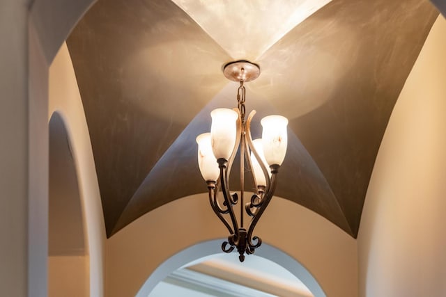 details with an inviting chandelier