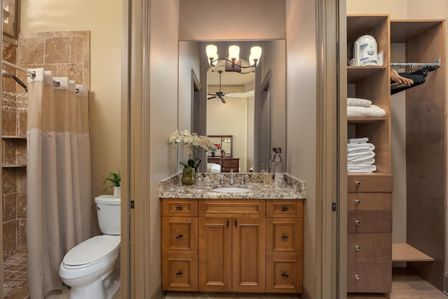 bathroom with vanity, toilet, and a shower with shower curtain