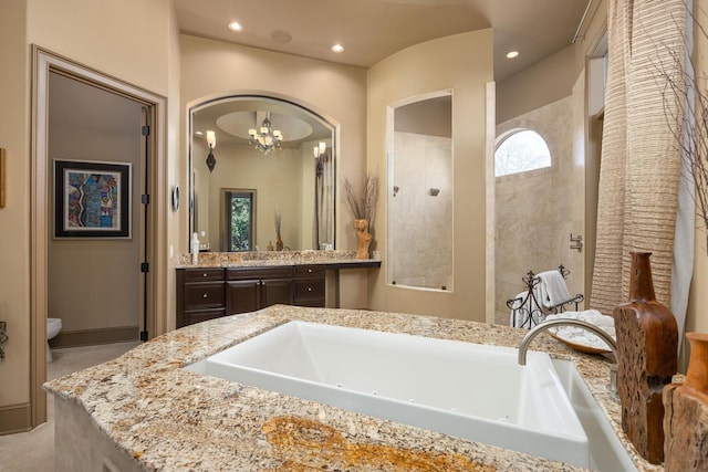 bathroom featuring vanity, a chandelier, toilet, and tiled shower