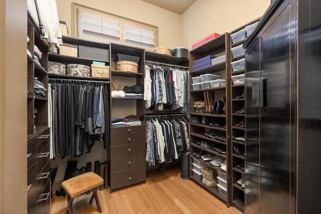 spacious closet featuring hardwood / wood-style flooring