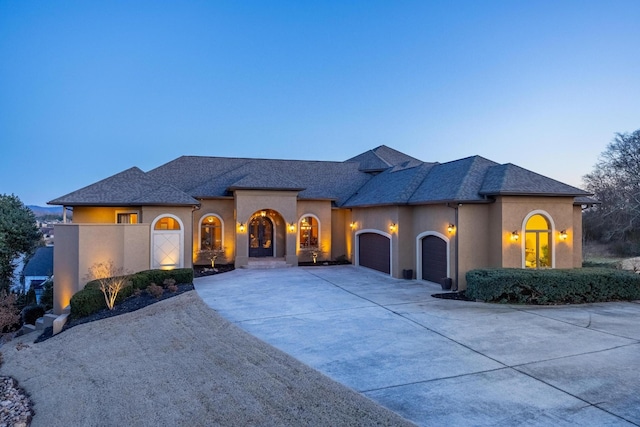 view of front of home with a garage