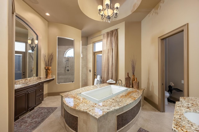 bathroom featuring a shower, vanity, toilet, tile patterned floors, and an inviting chandelier