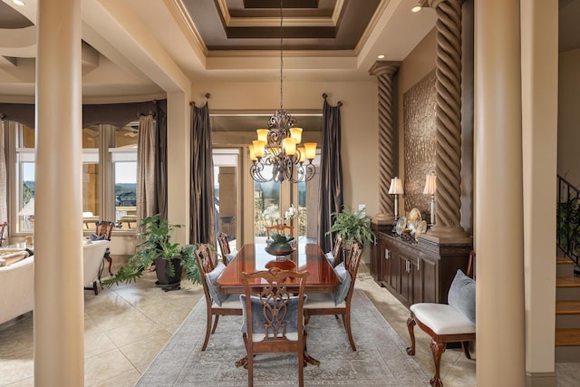 dining room featuring an inviting chandelier, crown molding, a raised ceiling, and light tile patterned flooring