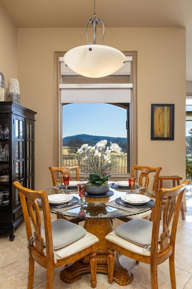 tiled dining area with a mountain view