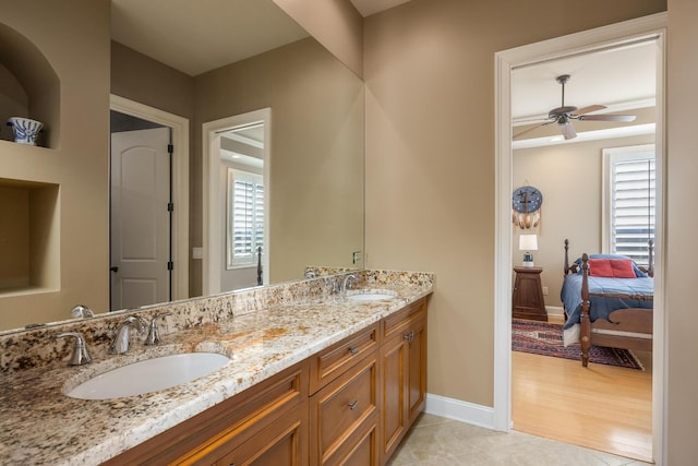 bathroom featuring vanity, tile patterned floors, and ceiling fan