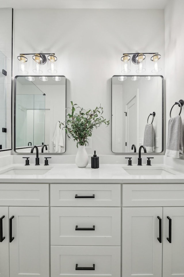 bathroom featuring vanity and a shower with door