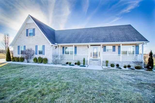 view of front of house featuring a porch and a front yard