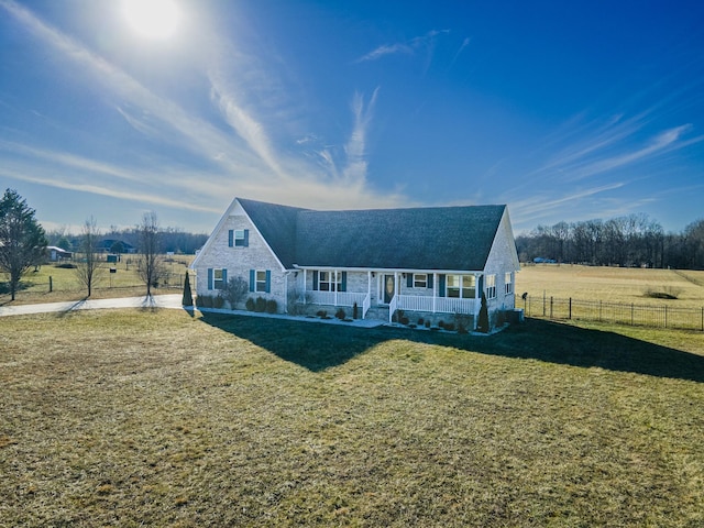 view of front of house featuring covered porch and a front lawn