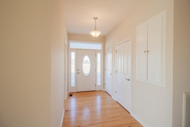 foyer entrance featuring light hardwood / wood-style flooring