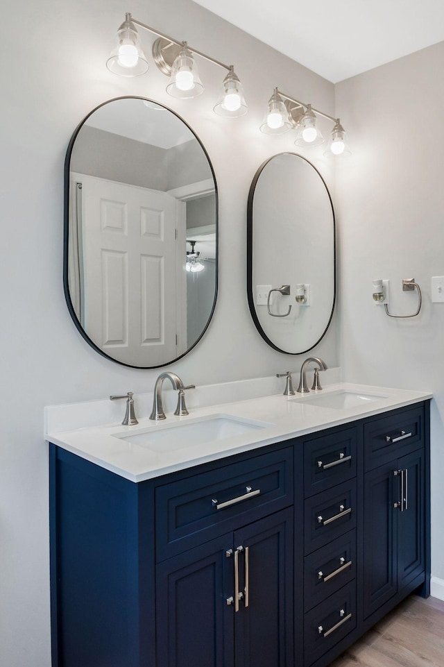 bathroom featuring vanity and hardwood / wood-style floors