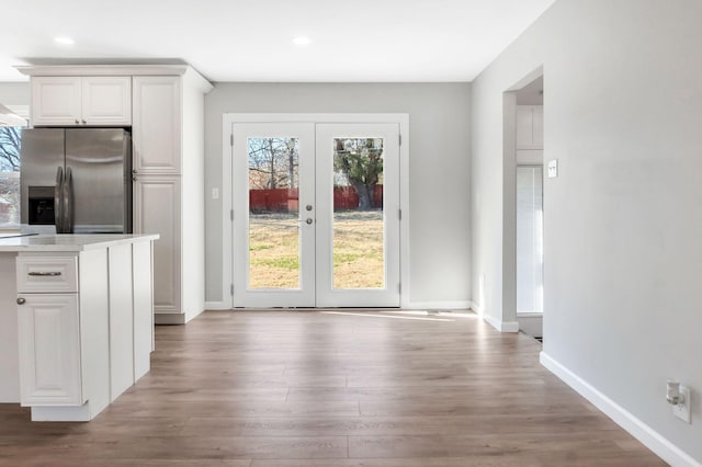 doorway featuring hardwood / wood-style flooring and french doors