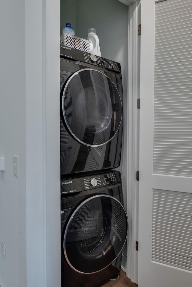 1125 10th Ave N Unit 210, Nashville, TN 37208 - laundry room featuring laundry area and stacked washer and dryer