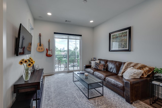 1125 10th Ave N Unit 210, Nashville, TN 37208 - living room with recessed lighting, baseboards, visible vents, and wood finished floors