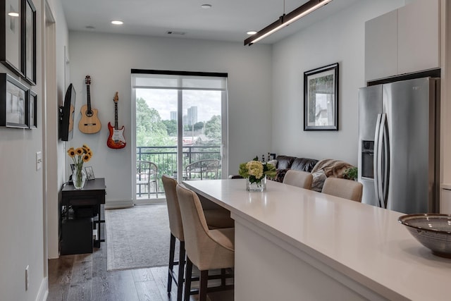 dining space featuring hardwood / wood-style floors