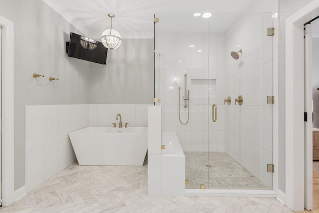 bathroom featuring shower with separate bathtub