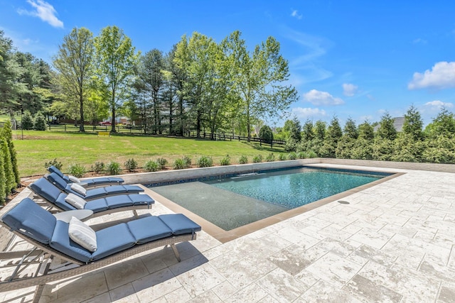 view of pool with a yard and a patio area