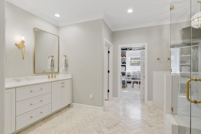 bathroom with vanity, ornamental molding, parquet floors, and walk in shower