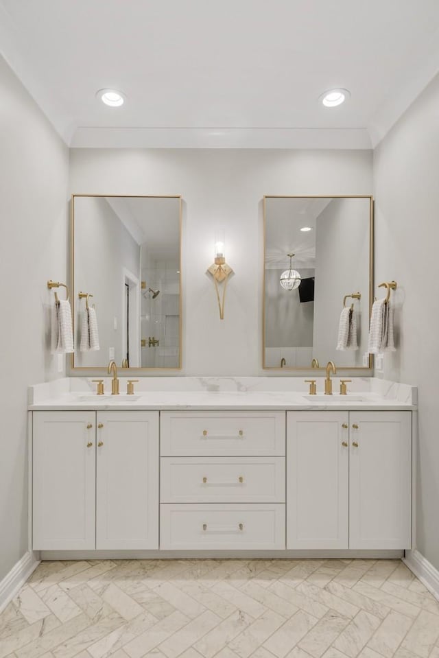 bathroom with vanity, crown molding, and a shower