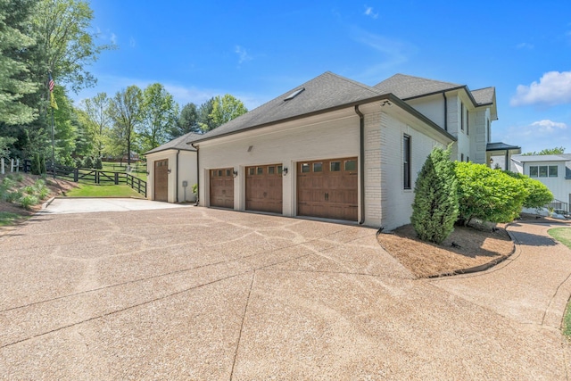 view of property exterior with a garage