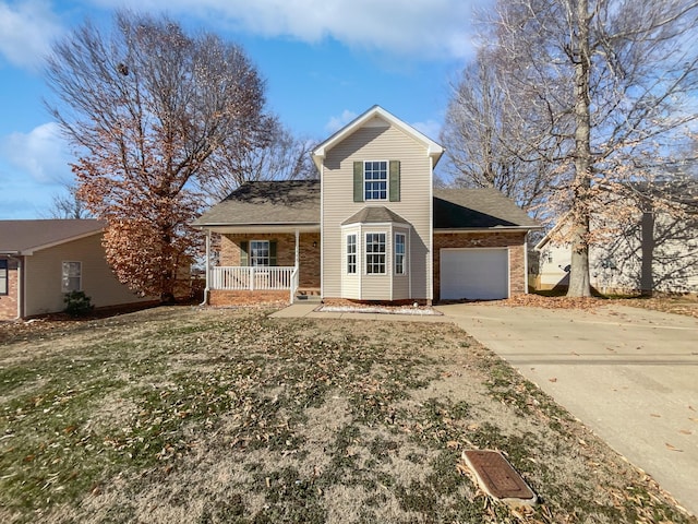 front of property with a garage, covered porch, and a front yard