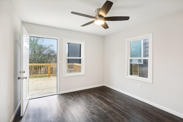 spare room with ceiling fan and dark hardwood / wood-style flooring