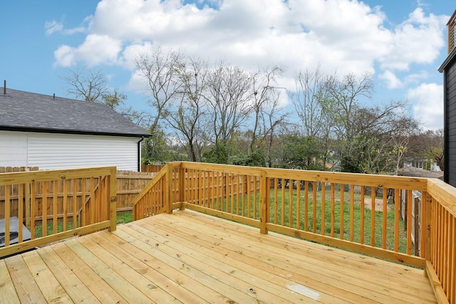 wooden deck with a lawn