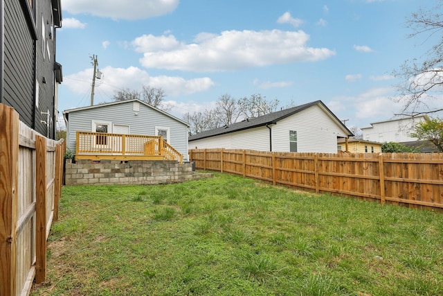 view of yard with a wooden deck