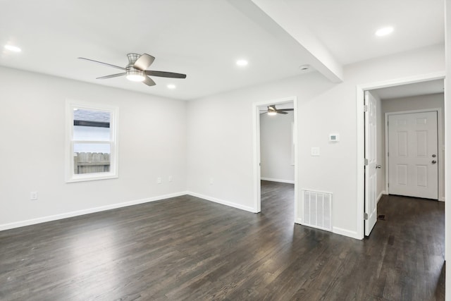 unfurnished room with ceiling fan and dark hardwood / wood-style flooring