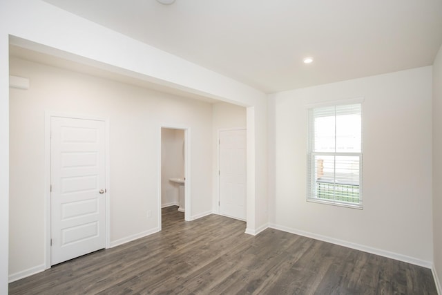 empty room featuring dark hardwood / wood-style floors