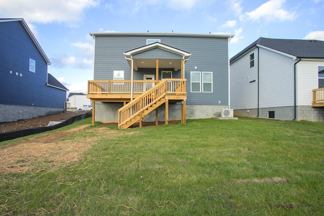 back of property featuring a deck, a lawn, and ac unit