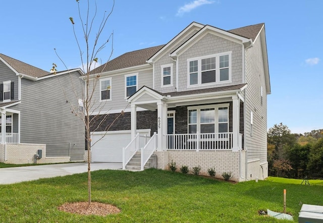 craftsman-style house with a garage, a porch, and a front yard