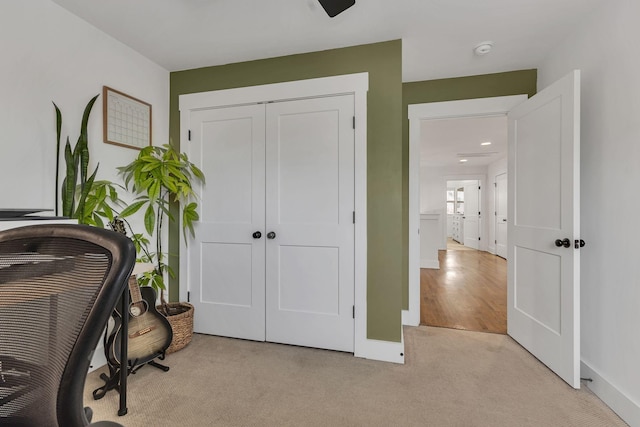 home office with light colored carpet