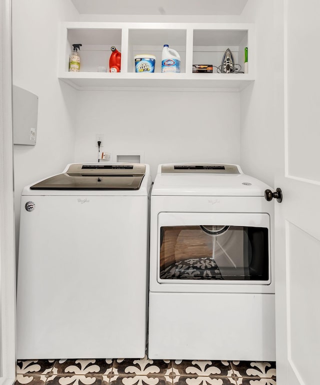 clothes washing area featuring built in features and washer and clothes dryer