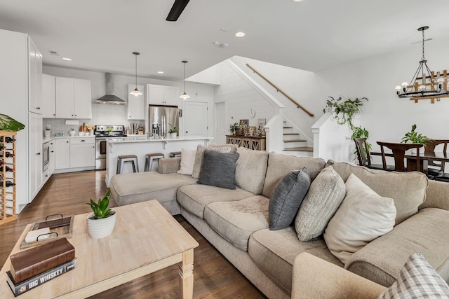 living room featuring dark wood-type flooring and a notable chandelier