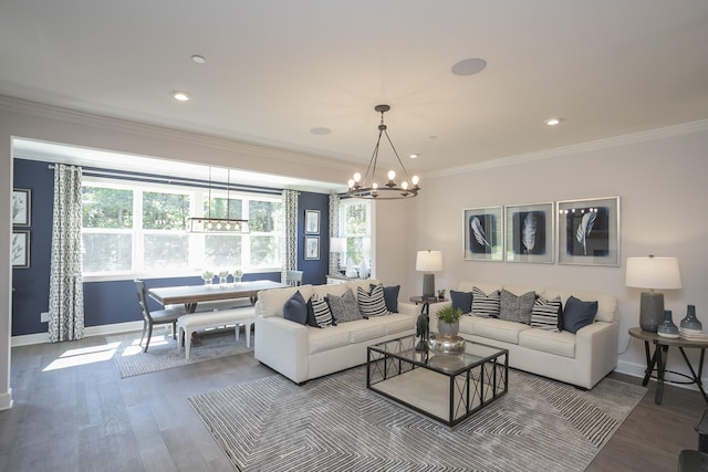 living room with hardwood / wood-style flooring, ornamental molding, and a wealth of natural light