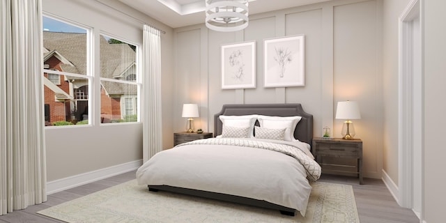 bedroom featuring light hardwood / wood-style floors and multiple windows