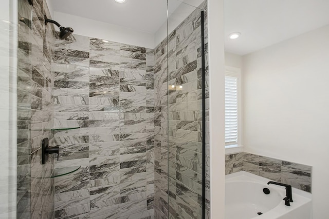 bathroom with shower with separate bathtub