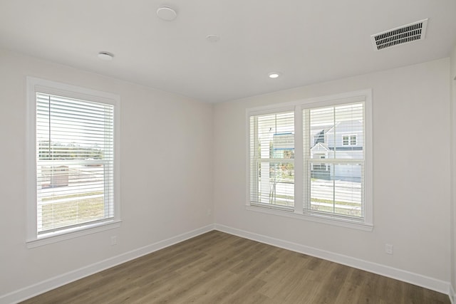 empty room featuring hardwood / wood-style flooring