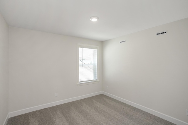 unfurnished room with carpet floors