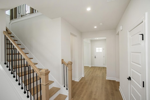 corridor with light hardwood / wood-style flooring